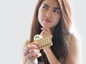 A women is holding Contraceptive Pills in the hands
